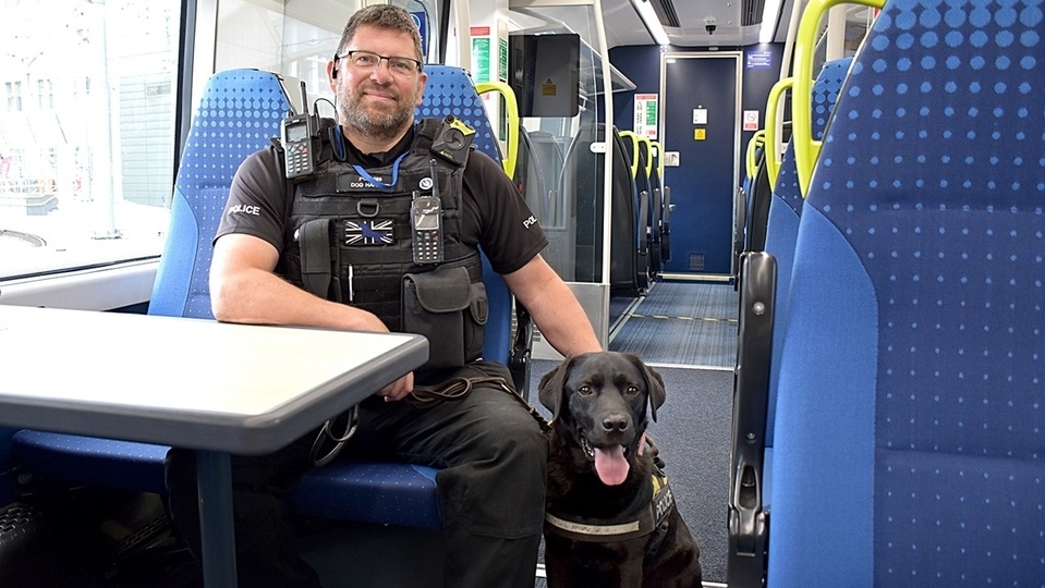 Handler PC Phil Healy is pictured with Harry