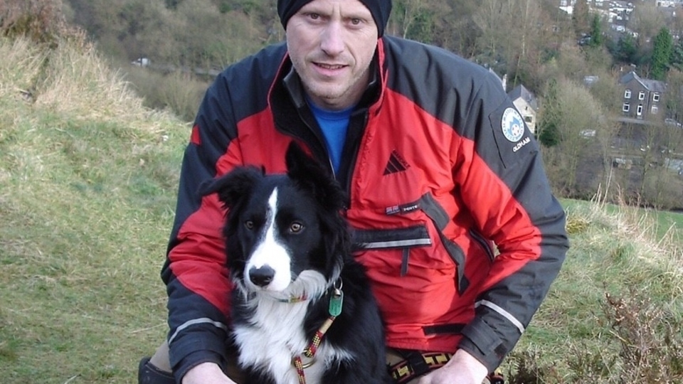Bob is pictured with his handler Mick Nield Bob is pictured with his handler Mick Nield