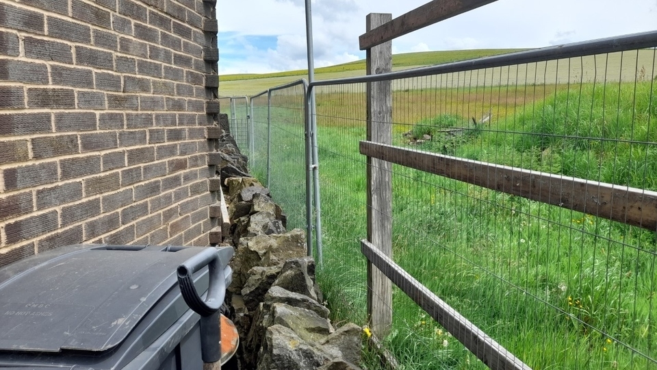 The current outlook at the side of Wendy Cash's house on Haven Lane. Cube Homes intend to build just 3.5 metres from their property