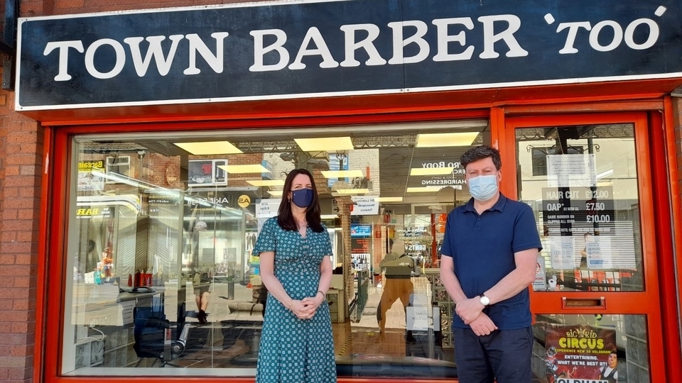 Oldham barber Patrick Scrivens is pictured outside his town centre shop with Christine Khiroya, Screening and Immunisation Lead at the Greater Manchester Health and Social Care Partnership