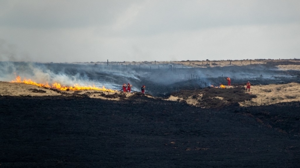 Firefighters battle the most recent fire on Marsden Moor in April