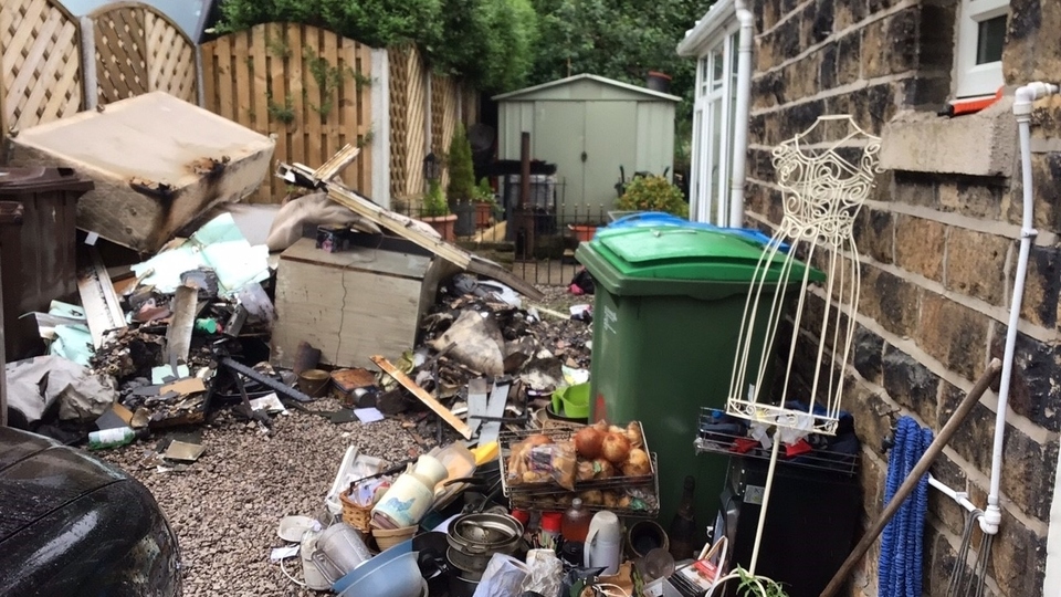 Some of Mr and Mrs Faulkner's fire damaged household items in the garden of their Diggle home