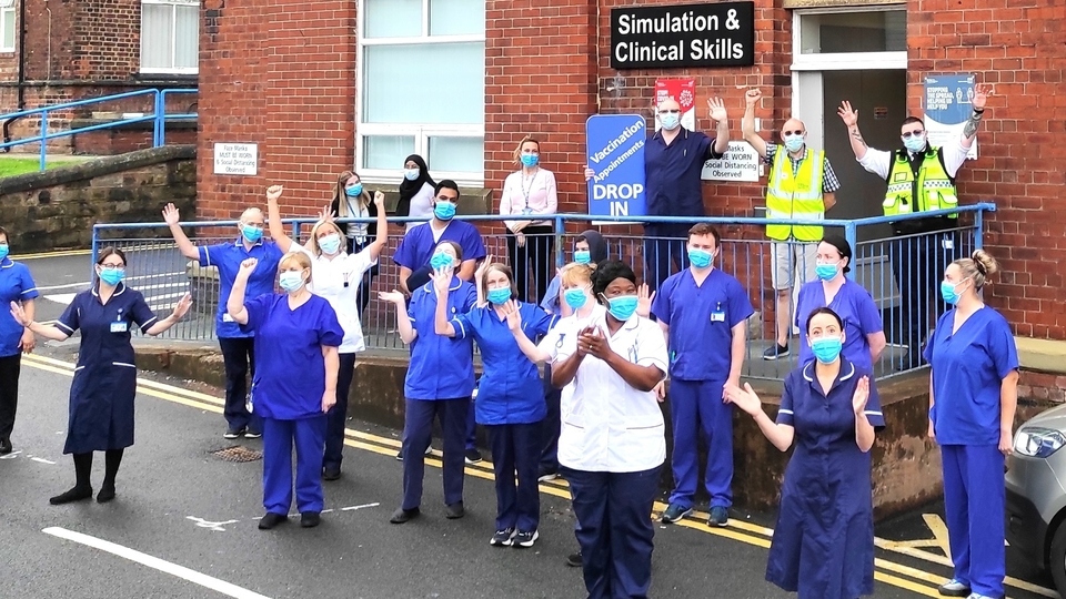 Royal Oldham Hospital staff celebrating a COVID vaccination milestone Royal Oldham Hospital staff celebrating a COVID vaccination milestone