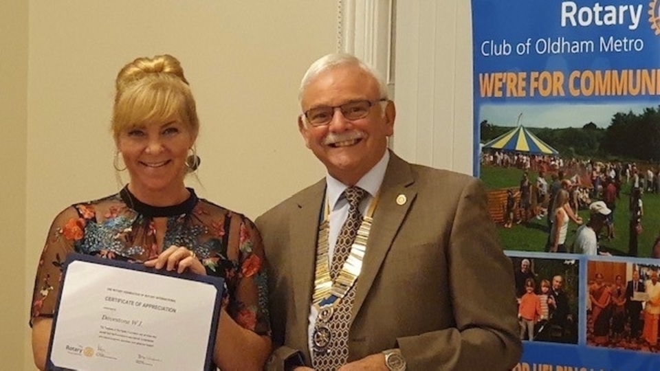 Jessica Moreland, President of Dovestone WI, receives the coveted honour from Garvin Crabtree, president of Rotary Oldham Metro Jessica Moreland, President of Dovestone WI, receives the coveted honour from Garvin Crabtree, president of Rotary Oldham Metro
