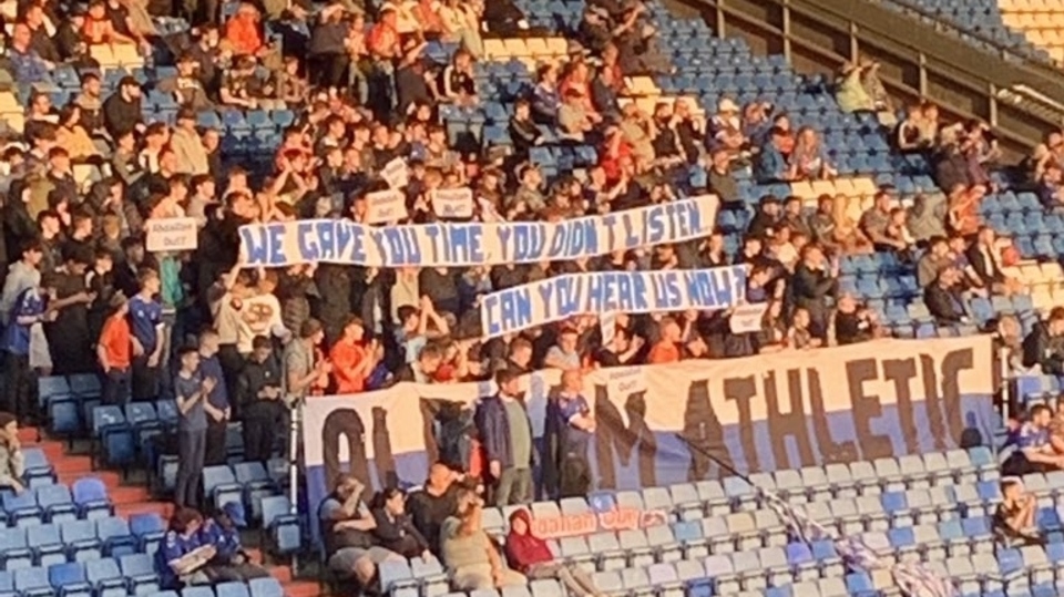 Latics fans make their views known last night. Image courtesy of Adam Millington on Twitter