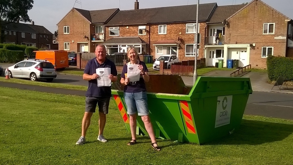 Riverside Housing Officer Alison Roberts and Cllr Phil Burke with one of the skips in Middleton
