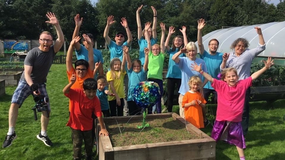 Rehearsing outdoors at the newly-refurbished Vale Mossley and the astonishingly beautiful community growing hub Veg in the Park in Waterhead, the children braved hot and muggy August weather to record their work Rehearsing outdoors at the newly-refurbished Vale Mossley and the astonishingly beautiful community growing hub Veg in the Park in Waterhead, the children braved hot and muggy August weather to record their work