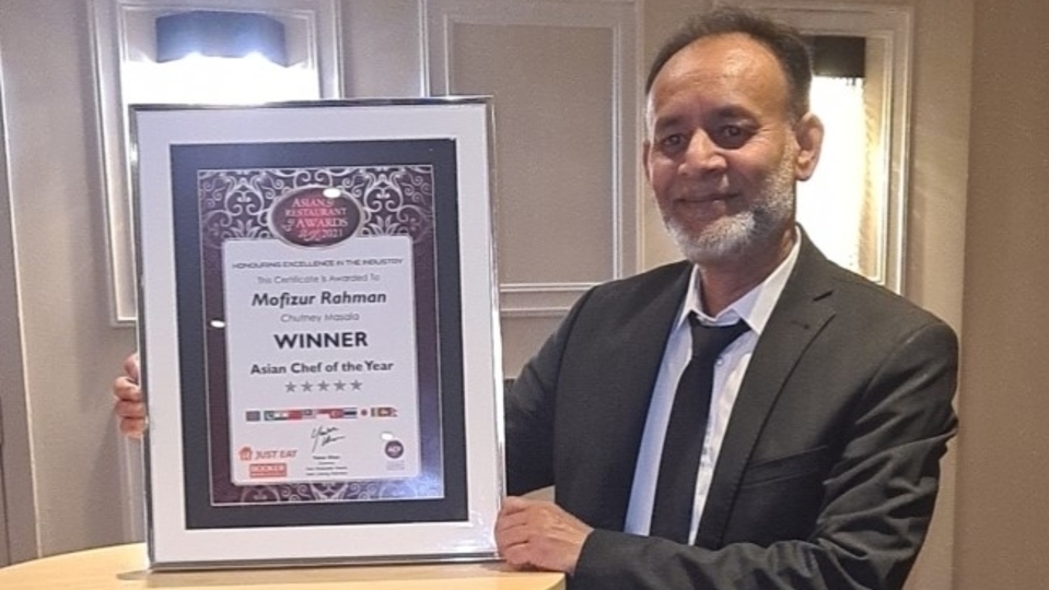 Mofizur Rahman proudly shows off his award Mofizur Rahman proudly shows off his award