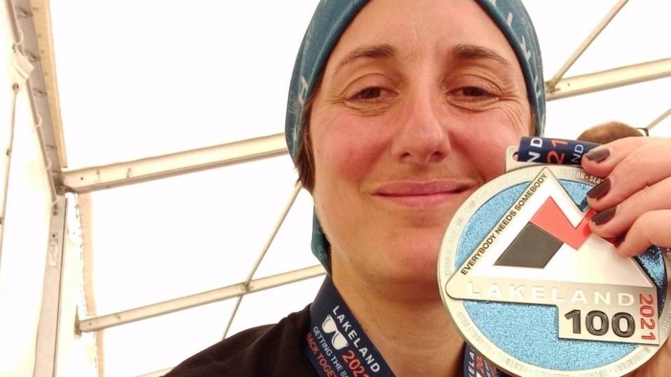 Ultra-runner Victoria Carter shows off her medal