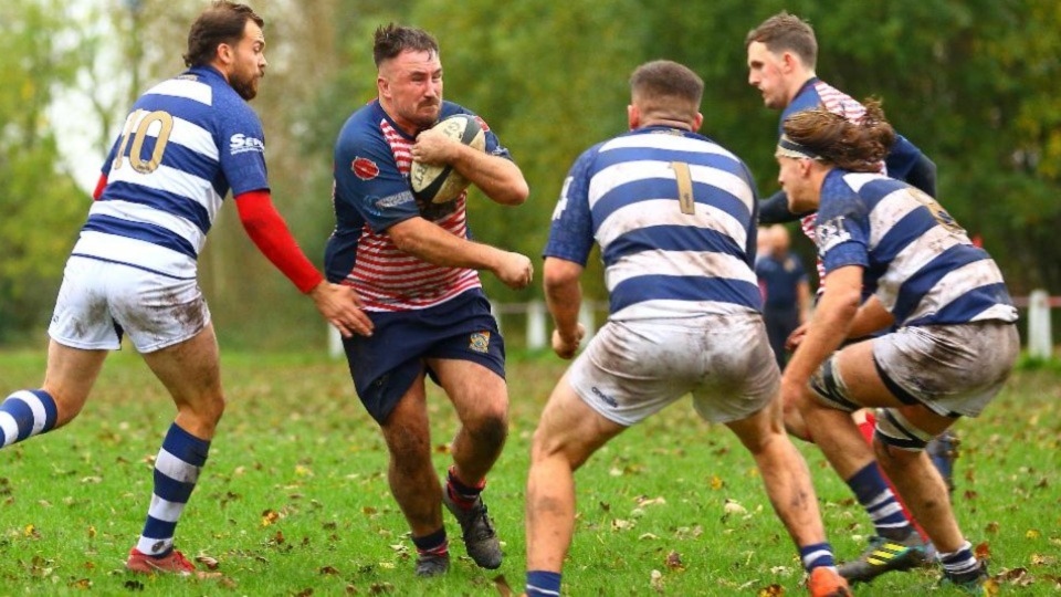 Oldham's Stuart Brennan looks for a gap against Eccles