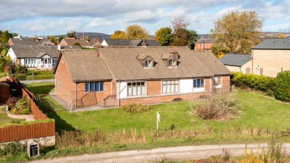 The famous old 'House on the Lake' which is now being offered for sale by Oldham estate agent Cornerstone