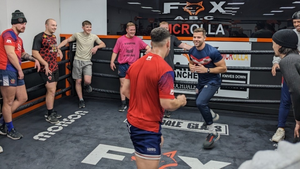 Matty Wilkinson faces an opponent in the ring. Image courtesy of ORLFC