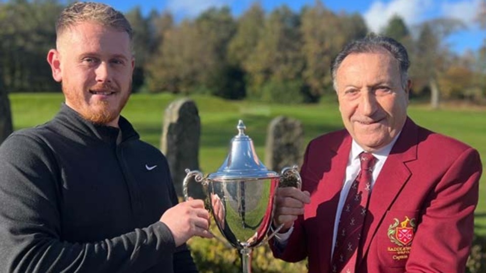 Mark Anderson-Wild is presented with the Mountain Ash Trophy by Saddleworth Captain Dave Newman