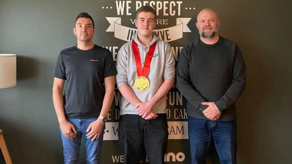 Joseph Brooks, Graphic Design apprentice, pictured at his employers - Rhino Group - celebrating his success at WorldSkills UK 2022. Left to right are: Lee Morris, Senior Creative, Rhino Group, Joseph, and Steve Phillips, Senior Creative, Rhino Group