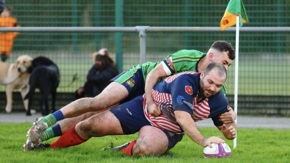 Andy Joy crashes over for one of his two Oldham tries