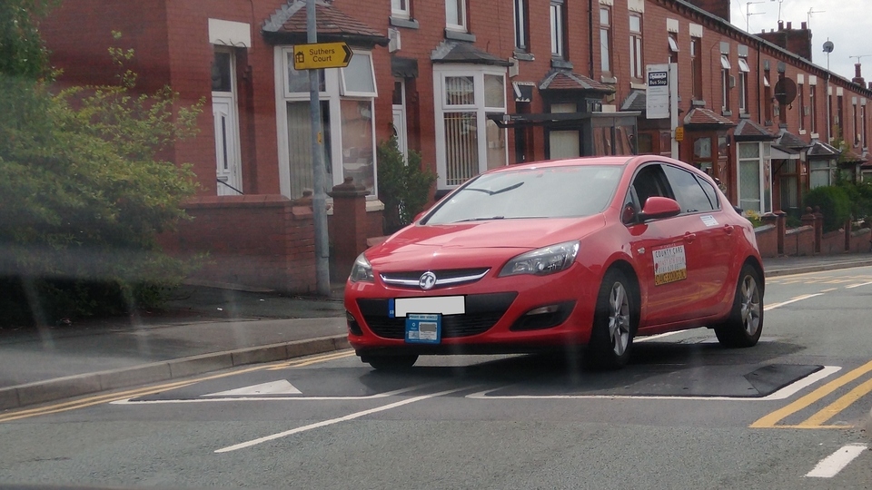 A car drives over road humps on Copsterhill Road 