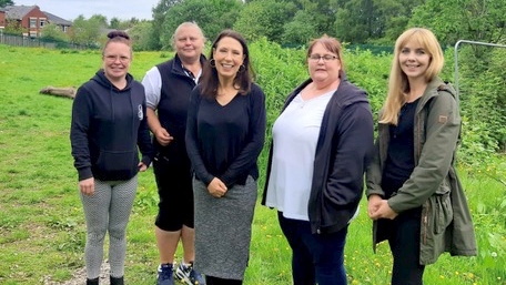 left to right - Candice Southern, Action Together, Councillor Angela Cosgrove, Debbie Abrahams MP, Leanne Brooks, and Councillor Leanne Munroe, visited the location where the garden will be in the playing field at the end of the path that runs in-front of St Theresa’s school and behind Shakespeare Road.