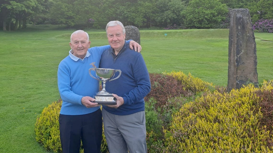 LOCAL LEGENDS: Great friends and fierce rivals Les Lawton and Alan Squires with the District Championship trophy they have done battle over many times.