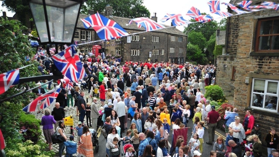 Villagers throng Dobcross Square for a service before setting off to join other churches in their Whit Walk to Uppermill. Images courtesy of Paul Clegg and Laura-Daisy Bennett