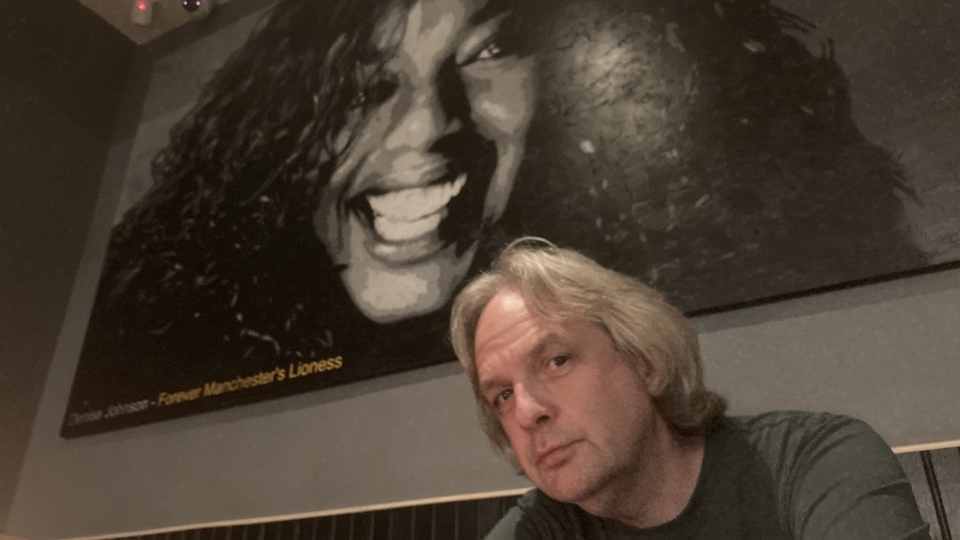 Locally-based artist Simon Mound is pictured alongside his large portrait of Denise Johnson Locally-based artist Simon Mound is pictured alongside his large portrait of Denise Johnson
