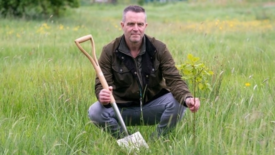 Nik Anderson, Senior Arboricultural and Countryside Officer, at the back of Bare Trees Primary School in Chadderton, where some of the new trees have been planted