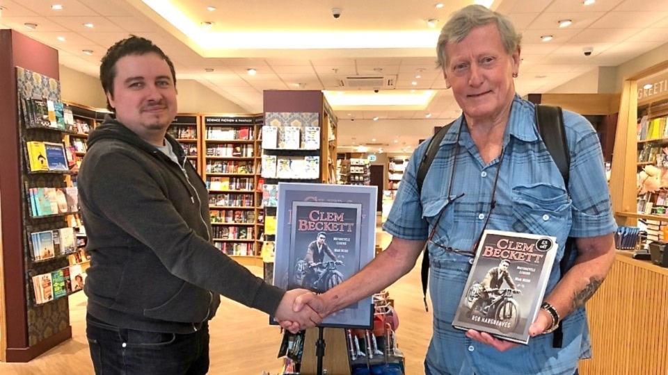 Author Rob Hargreaves (in blue shirt) is pictured at the book-signing with Oldham Waterstones manager Ryan Creely