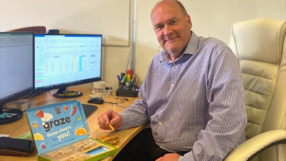 Aspect IT director Ian Howarth enjoying a nutritious snack during the workday Aspect IT director Ian Howarth enjoying a nutritious snack during the workday