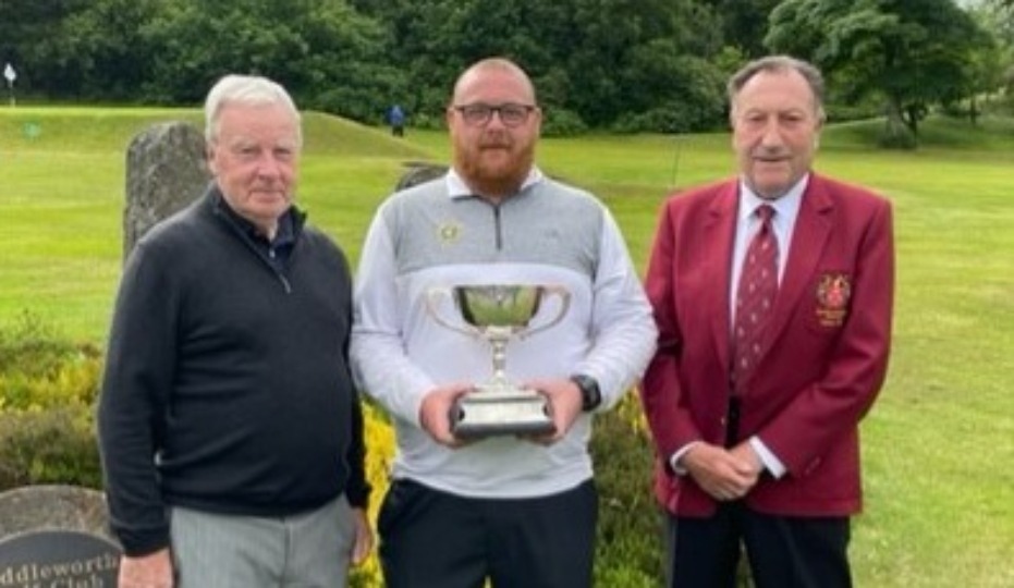 Adam Rowbotham is flanked by Alan Squires (left) and Saddleworth captain Dave Newman