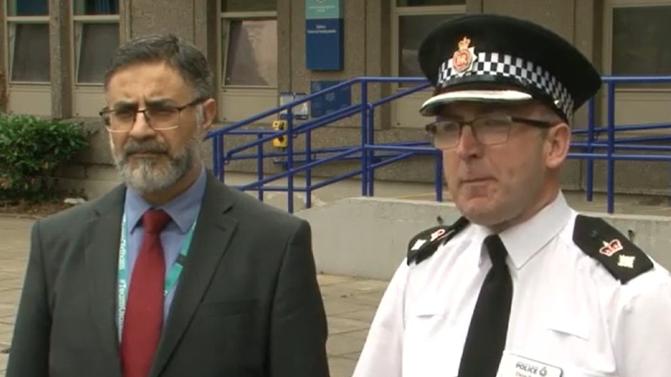 Oldham police's Chief Superintendent Chris Bowen (right) is pictured with council chief Sayyed Osman