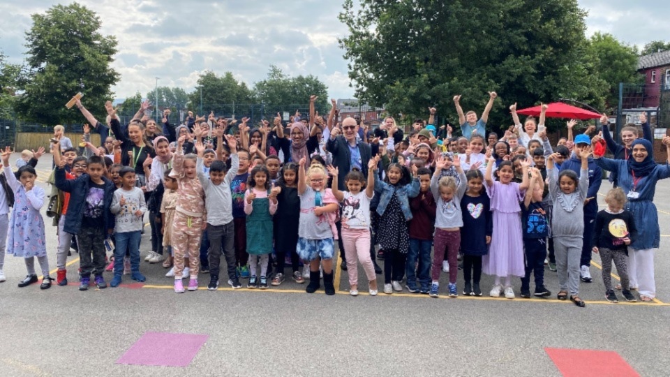 Cllr Eddie Moores pictured with children during a summer HAF event