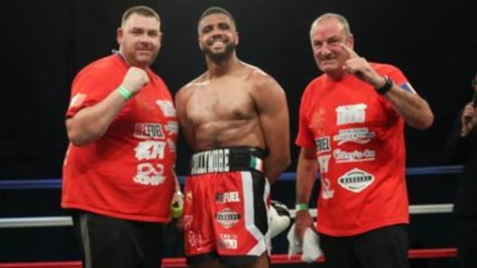 Leyton Collymore (centre) celebrates his latest victory with his Dad and coach John Carr (left) and Joe Pennington, head coach at his gym, Northside Leyton Collymore (centre) celebrates his latest victory with his Dad and coach John Carr (left) and Joe Pennington, head coach at his gym, Northside