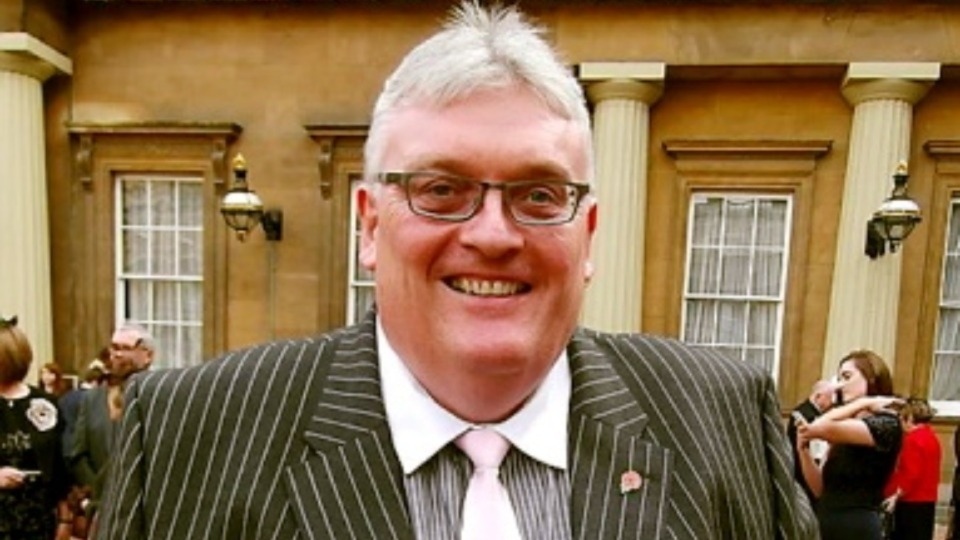 Councillor Howard Sykes pictured at Buckingham Palace after receiving his MBE from the Queen in 2014