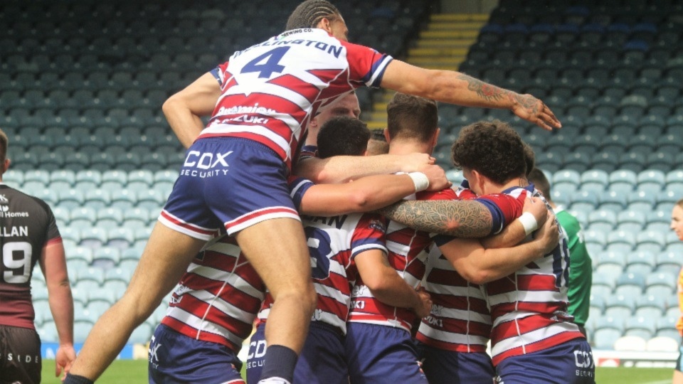 Oldham's players celebrate one of their four tries. Image courtesy of ORLFC