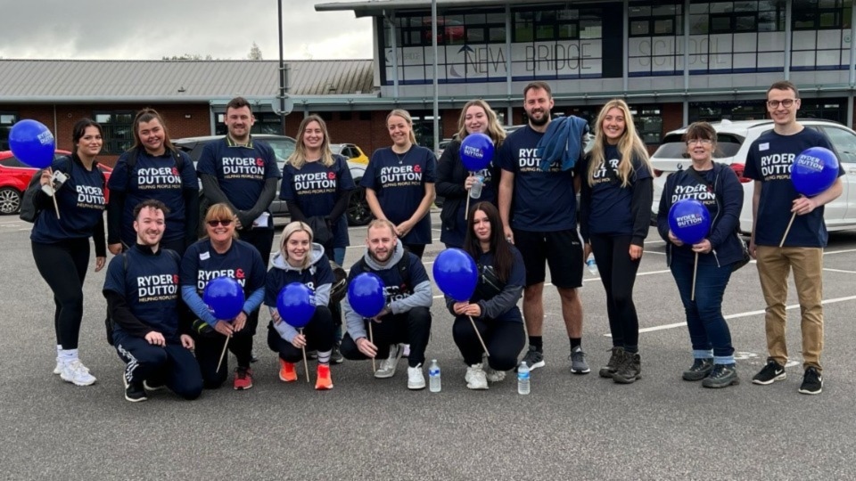 Pictured are the Ryder and Dutton team outside the school during their sponsored walk