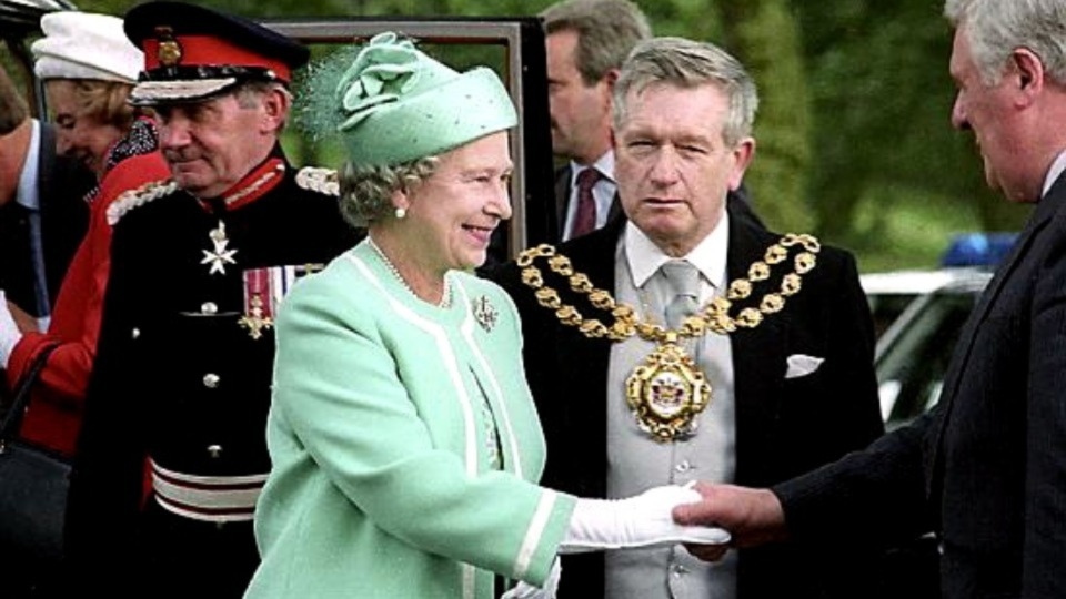 It's 1992 and pictured are the then Mayor of Oldham, Councillor Norman Bennett, joining the Queen as she shakes hands with Colin Smith, then the council’s chief executive