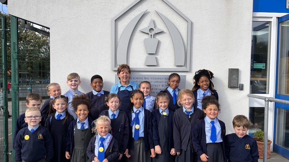 Catering manager Pat is pictured with some of the Corpus Christi children