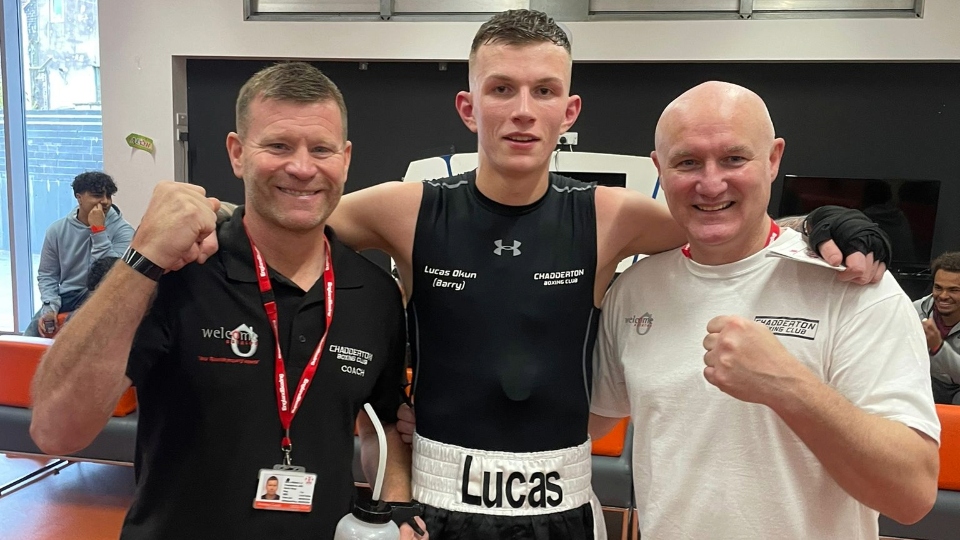 Triumphant Lucas Okun is flanked by coaches Gary Hibbert and Paul Cave