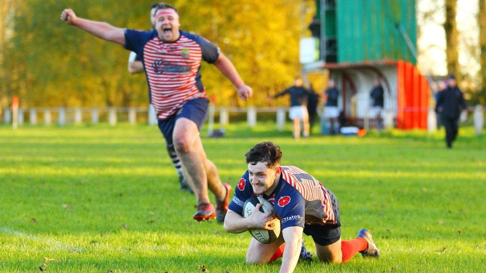 Get in there: James Perks goes over for an Oldham try