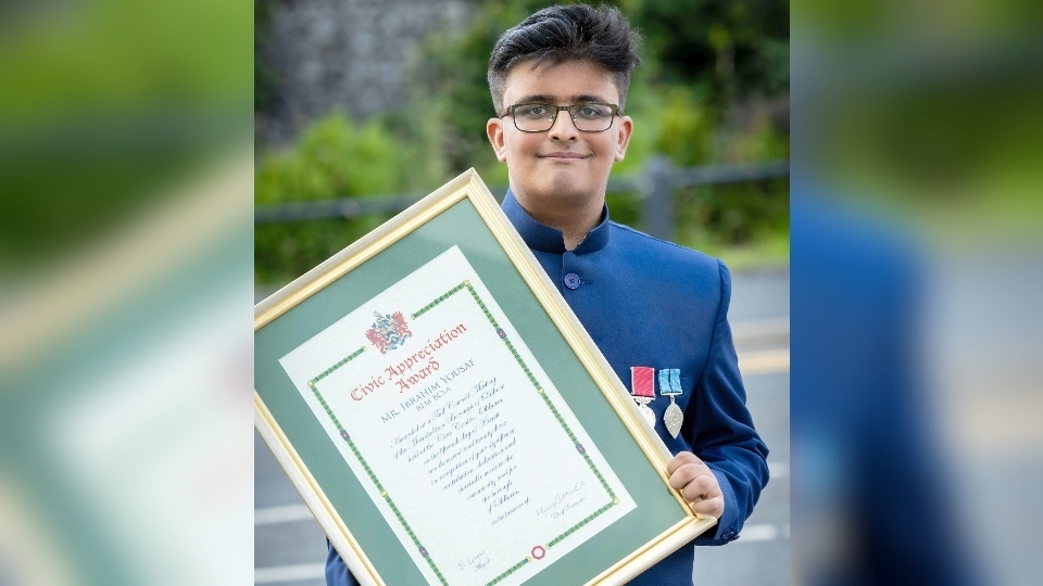 Ibby Yousaf proudly shows off a Civic appreciation award he received earlier this year. Image courtesy of Darren Robinson Ibby Yousaf proudly shows off a Civic appreciation award he received earlier this year. Image courtesy of Darren Robinson