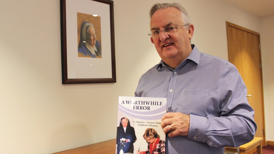 Chief Executive Revd David Ireland, who is from Dobcross, pictured with the new book Chief Executive Revd David Ireland, who is from Dobcross, pictured with the new book