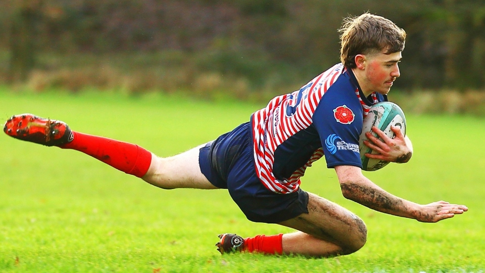 Jenson Hamilton dives over to score Oldham's sole try