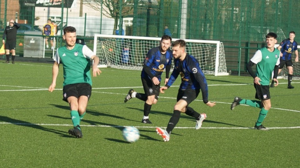 Action from the top flight clash between Salford Vics (green shirts) and local side Shaw Athletic