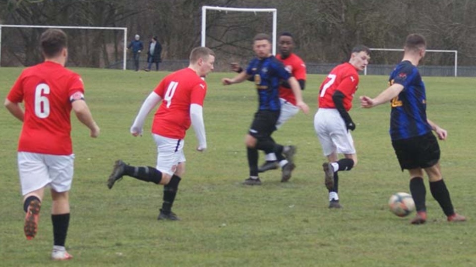 Action from the game between Shaw Athletic and Stretford Paddock, which Athletic won 5-1