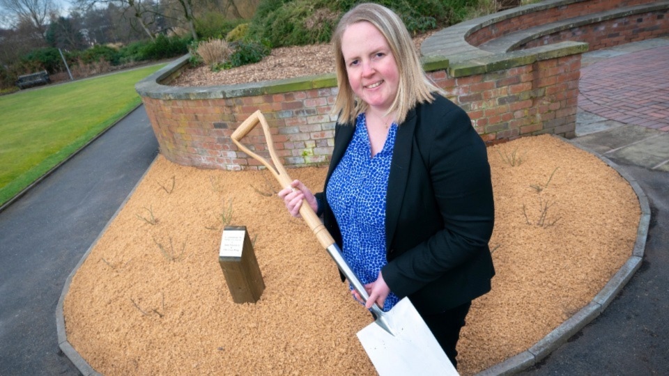 Councillor Amanda Chadderton, Leader of Oldham Council, is pictured at Alexandra Park helping plant one of the first roses