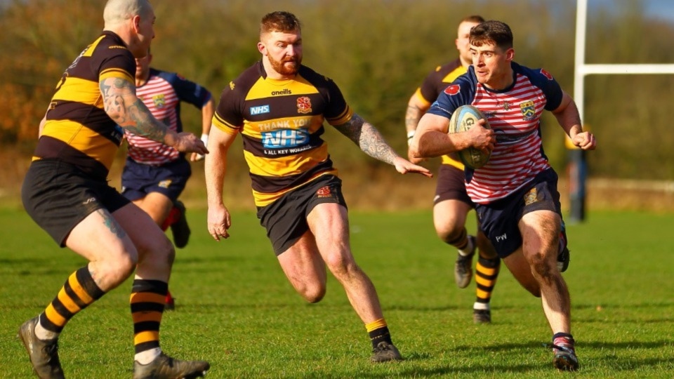 Oldham's Phil Whitham (right) makes a break