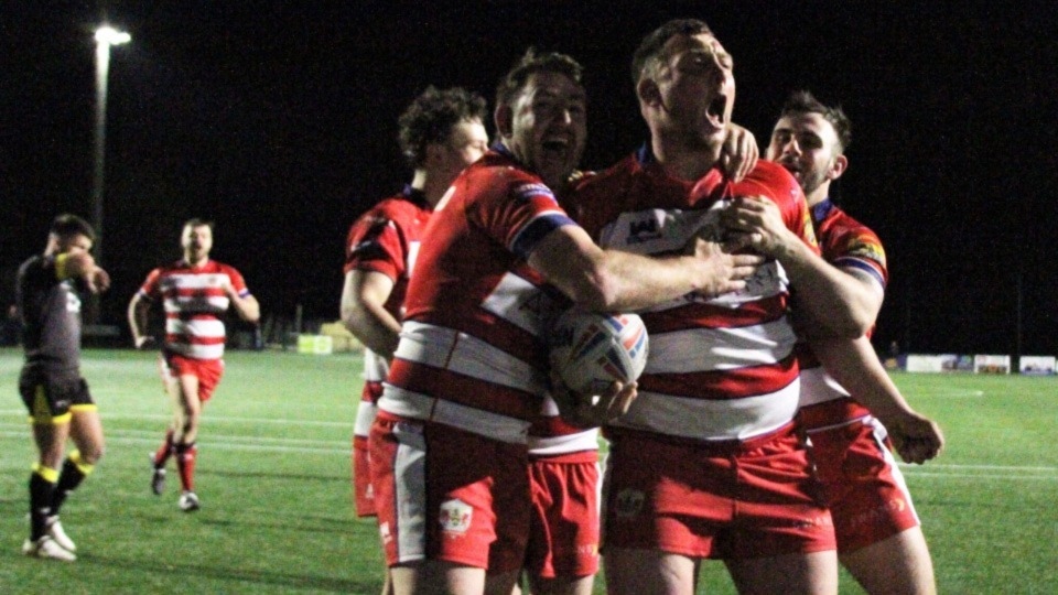 Luke Nelmes celebrates a try in style