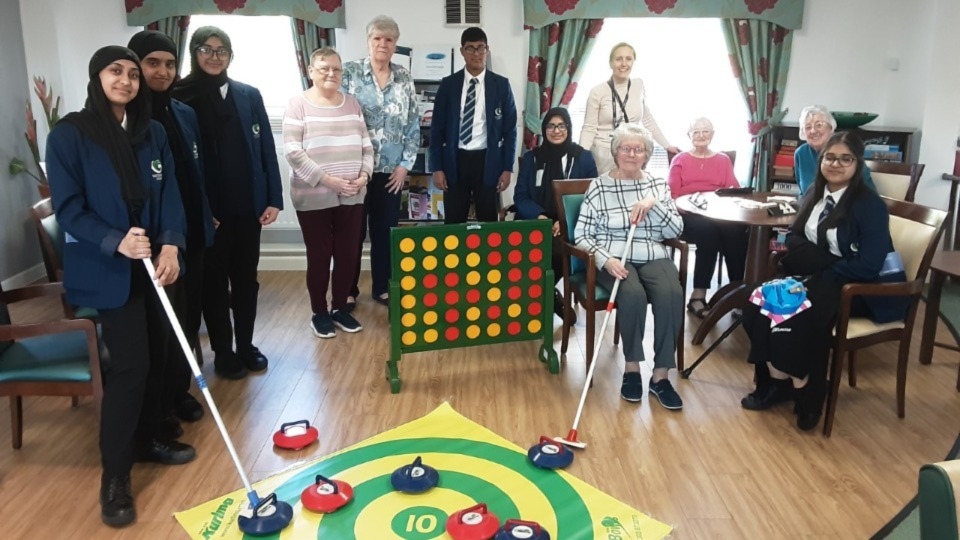 The range of activities that Waterhead Academy students and residents participate in together include board games, crafting, curling, crocheting and baking