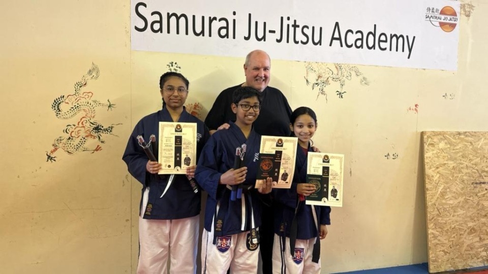 Junior black belt students Zara, Ishmaeel and Zainab are pictured with Sensei Mark Coope Junior black belt students Zara, Ishmaeel and Zainab are pictured with Sensei Mark Coope