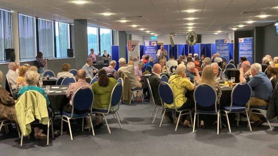 Radio Cavell chairman Kent Wells delivers a speech to the Oldham Event Centre party-goers