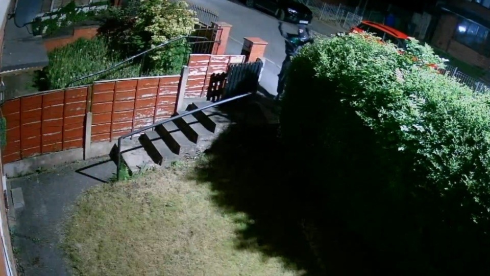 Images show a hooded figure holding a car theft ‘bridging device’ outside a house Images show a hooded figure holding a car theft ‘bridging device’ outside a house